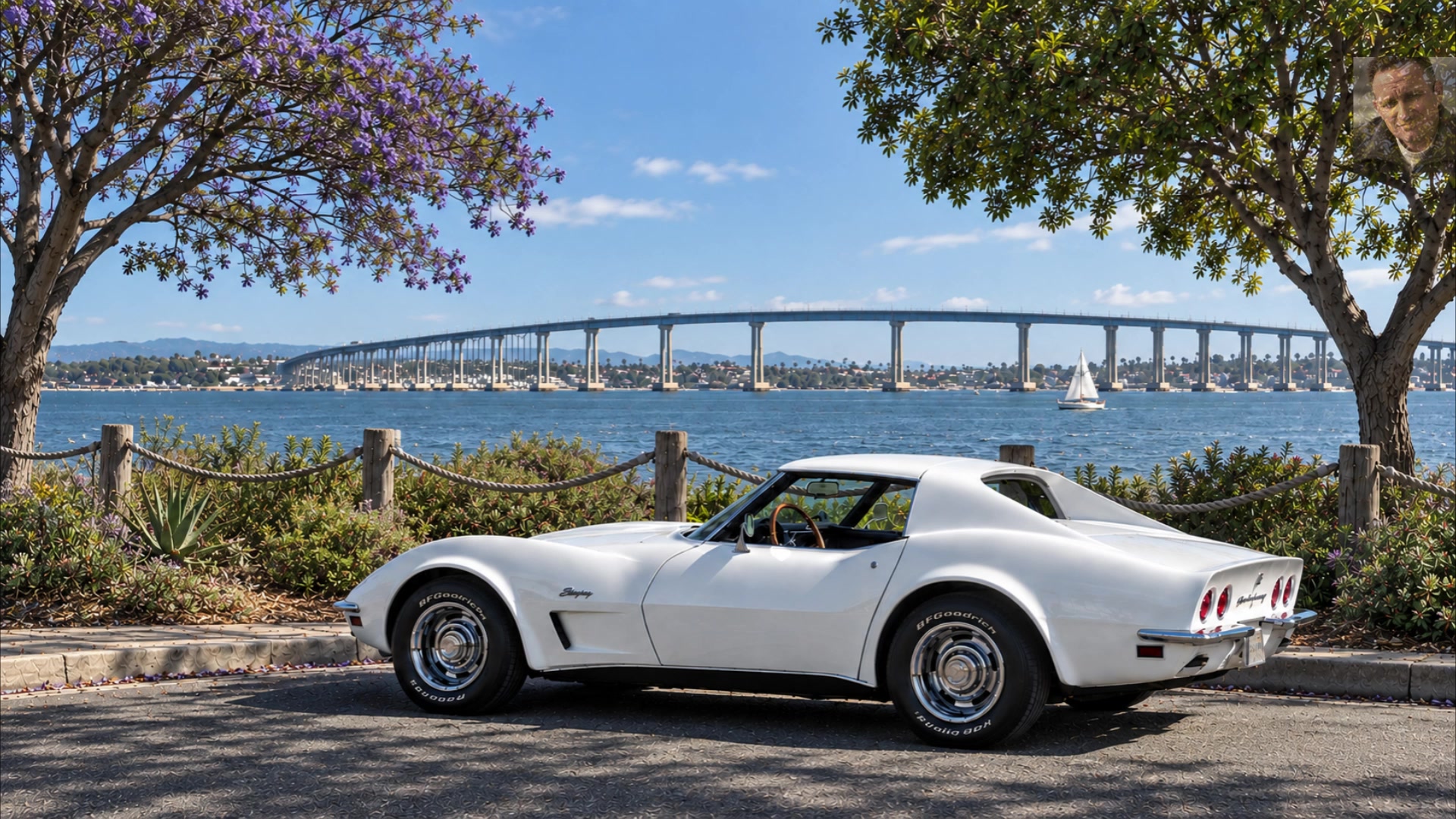 White Corvette beside San Diego Bay and the Coronado Bridge